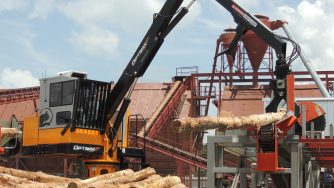 Rotobec log loader releasing a log with his log grapple.