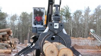 Rotobec log grapple picking two logs.