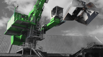 Rotobec clam bucket open on a big green loader.