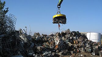 A scrap magnet handling scrap metal.
