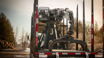 elite f&r loader on the back of a truck