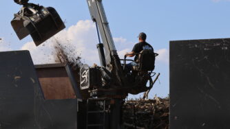 man operating elite in refuse